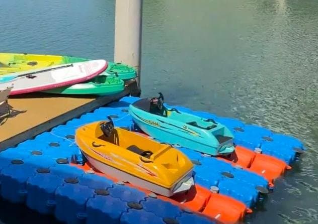 Floating pontoon berths ready for a rental kart boat fleet